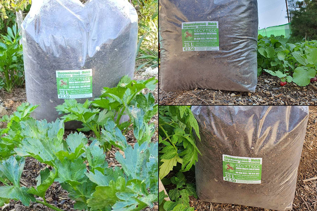 Three 25 litre mulch bags surrounded by growing vegetables.